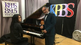 Paul Ryu (left) seated and Robert Lopez are pictured in the KPBS studio on May 14, 2018.
