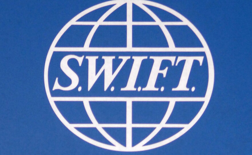 A sign for the Society for Worldwide Interbank Financial Telecommunication (SWIFT) outside the group's headquarters in Brussels.