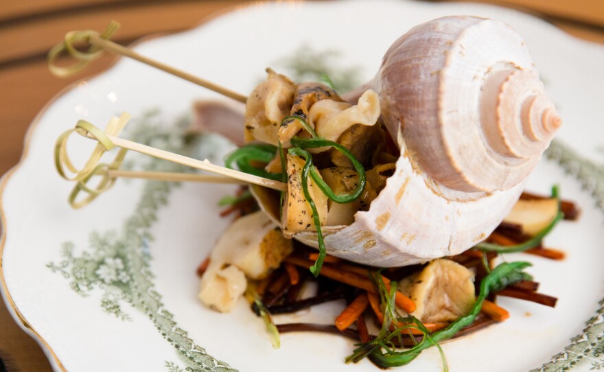 The whelk dish is a tribute to Canada's indigenous Mi'kmaq people and their reliance on fresh seafood. They have fished whelk off the Atlantic coast for hundreds of years, and used the shells as currency and for arts and crafts. The dish includes grilled whelk with a kombu (seaweed) beurre blanc, with sauteed burdock root and carrot.