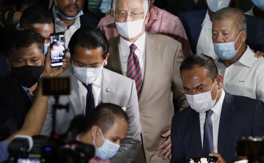 Former Malaysian Prime Minister Najib Razak, center, leaves a court house in Kuala Lumpur, Malaysia on July 28, 2020. Malaysia's Appeal Court today upheld his conviction linked to the 1 MDB scandal.
