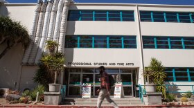 A student passes the College of Professional Studies and Fine Arts Building at San Diego State University on March 28, 2019. The building was closed because of noxious odors created from roof repairs. (Brandon Quester/inewsource)