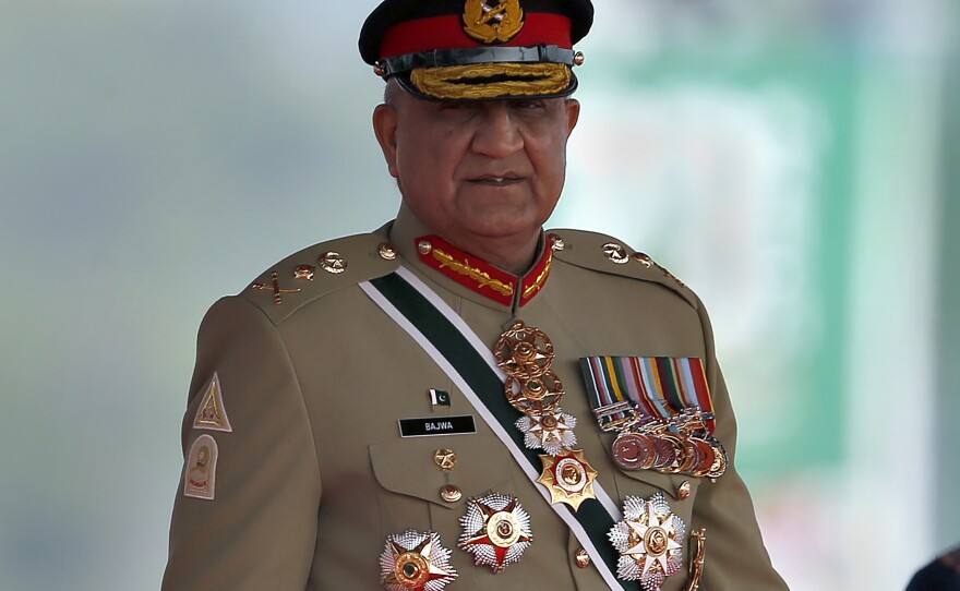 Pakistan's Army Chief Gen. Qamar Javed Bajwa arrives for a military parade to mark Pakistan National Day in Islamabad, Pakistan, March 23, 2022. He is retiring early next week.