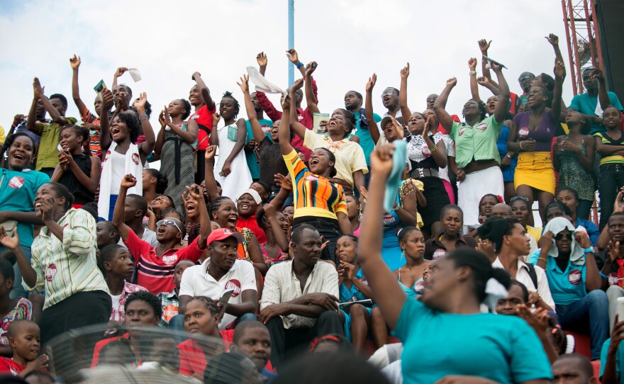 Thousands of Haitians dance and cheer as the finalists sing their songs of child slavery at Port-au-Prince's soccer stadium on Aug. 23.