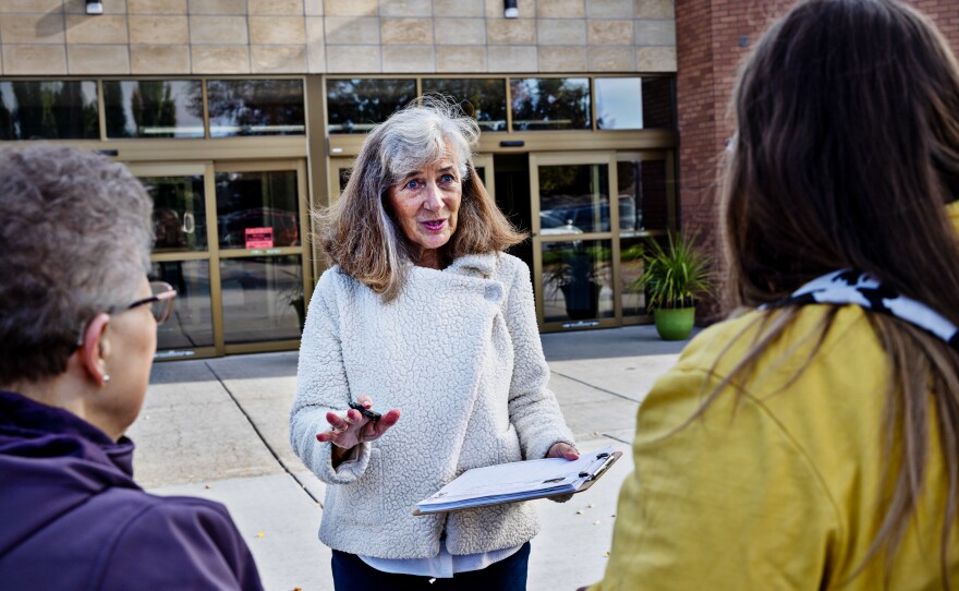 Parents Against Bad Books co-founder Carolyn Harrison (center) talks with people last month outside the public library in Idaho Falls, Idaho, about what she considers obscene books on the shelves.