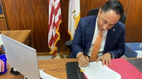 Mayor Todd Gloria signs an ordinance to ban "ghost guns" in the City of San Diego at his office in San Diego, Calif. Sept. 23, 2021.  
