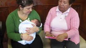 Elva Jaldin, a <em>promotora,</em> talks with Andrea Velandia about health. Soon Jaldin will help women like Velandia sign up for health insurance under the Affordable Care Act.