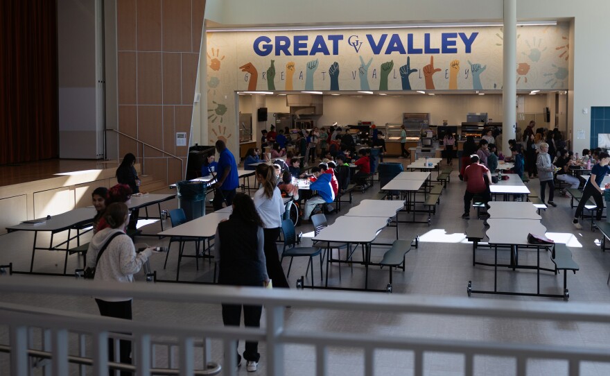 Sixth-grade students arrive for lunch in the cafeteria of the Great Valley 5/6 Center.