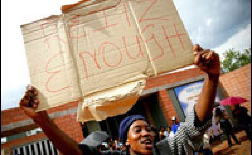 A South African student protests a racist video made by four white students at the University of the Free State.