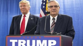 Then-Republican presidential candidate Donald Trump is joined by Joe Arpaio, the then sheriff of metro Phoenix, during a news conference in Marshalltown, Iowa. Trump isn't expected to take action Tuesday, Aug. 22, 2017. 