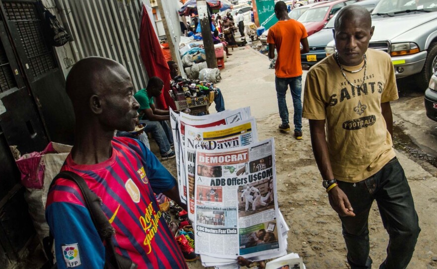 Not every business has been hurt by the Ebola epidemic: Stephen Kollie says his newspaper stand is thriving because people are hungry for the latest Ebola information. But many of his usual expatriate customers have left the country, he says.