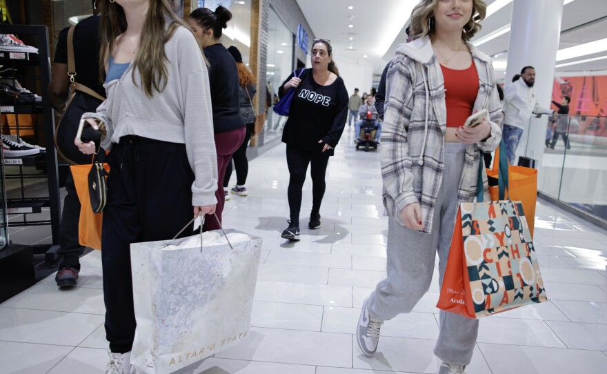 Women carry shopping bags as customers visit the American Mall dream mall during Black Friday on Nov. 25, 2022 in East Rutherford, N.J. The U.S. economy ended 2022 on a strong note, but fears of a recession are growing.