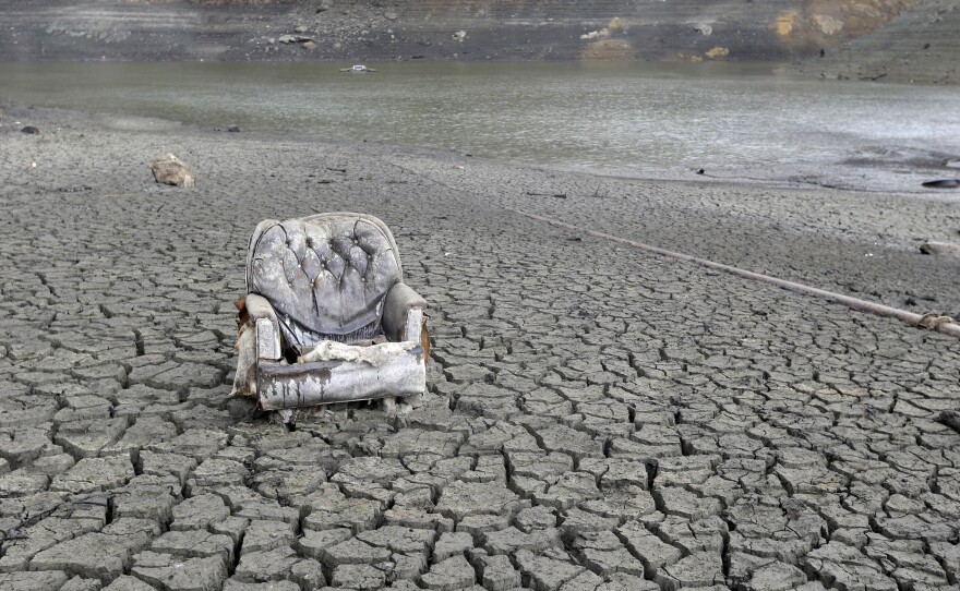 The cracked-dry bed of the Almaden Reservoir is seen on Friday, in San Jose, Calif.