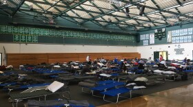 Evacuees rest at the Oceanside High School fire shelter, Friday, Dec. 8, 2017. 