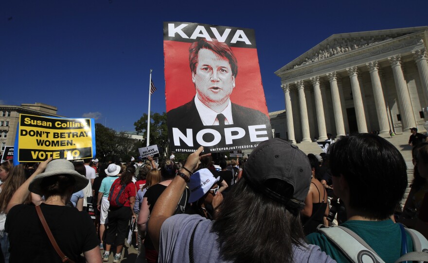 Demonstrators gather Thursday outside the Supreme Court, demanding that the Senate reject Judge Brett Kavanaugh's nomination.