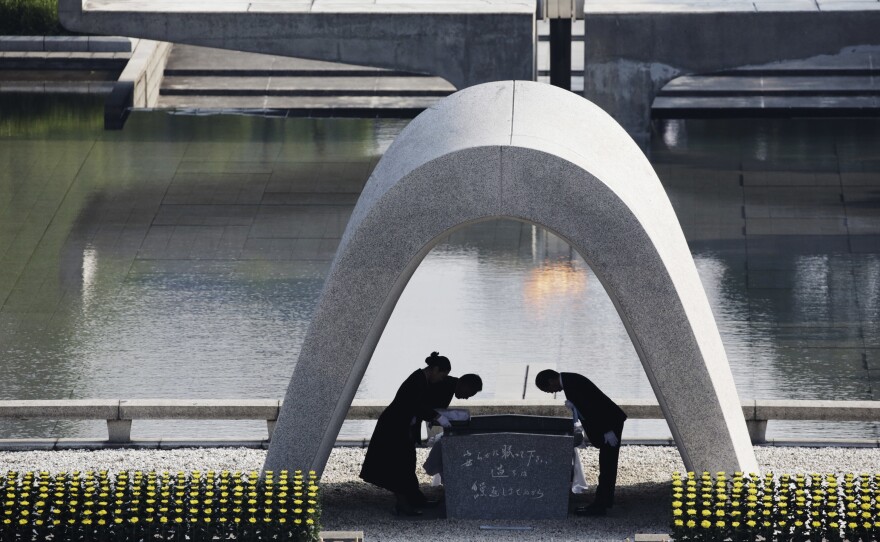 The mayor of Hiroshima and family of the deceased bow at the Hiroshima Memorial Cenotaph at Hiroshima Peace Memorial Park last year — the 70th anniversary of the bombing.