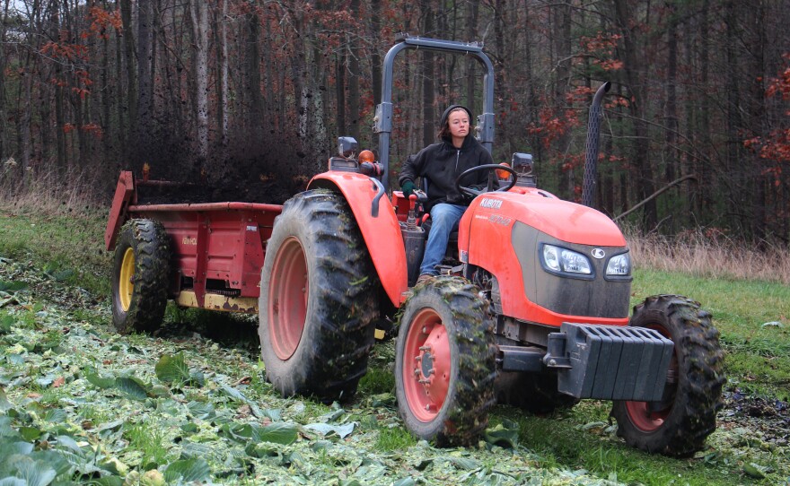 Pearl Wetherall, field manager at New Morning Farm, spreads manure.