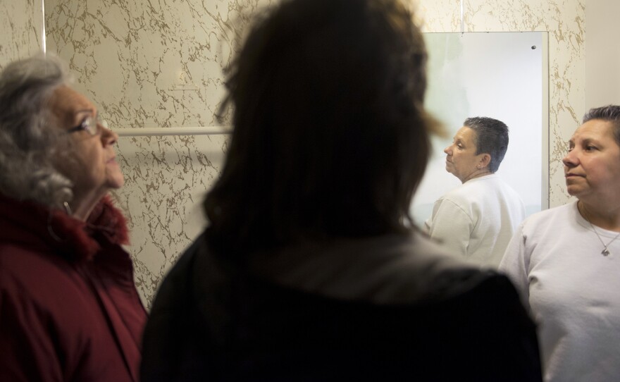 Resident Bonita Johnson (left), on-site manager Nancy Stock and Natividad Seefeld check to see if updates and repairs are done in a rental home bathroom as they prepare for a future resident at Park Plaza Cooperative.