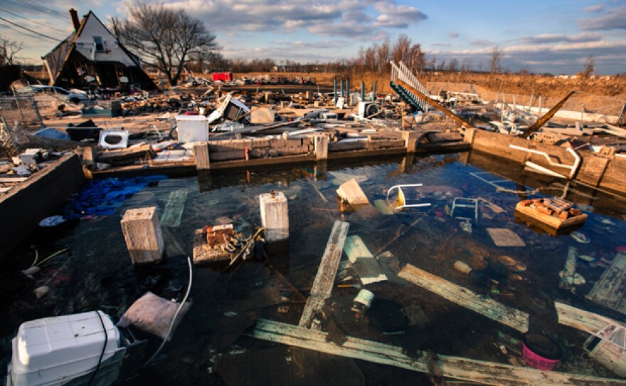 A still-running water pipe floods the foundation of a home destroyed by the storm surge of Superstorm Sandy in Staten Island, New York, in a photo taken on Nov. 28, 2012.