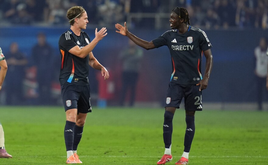San Diego FC midfielder Onni Valakari, left, celebrates his goal with teammate midfielder Manu Duah, right, during the first half of Game 1 in the first round of MLS soccer's Western Conference playoff against Portland Timbers Sunday, Oct. 26, 2025, in San Diego.