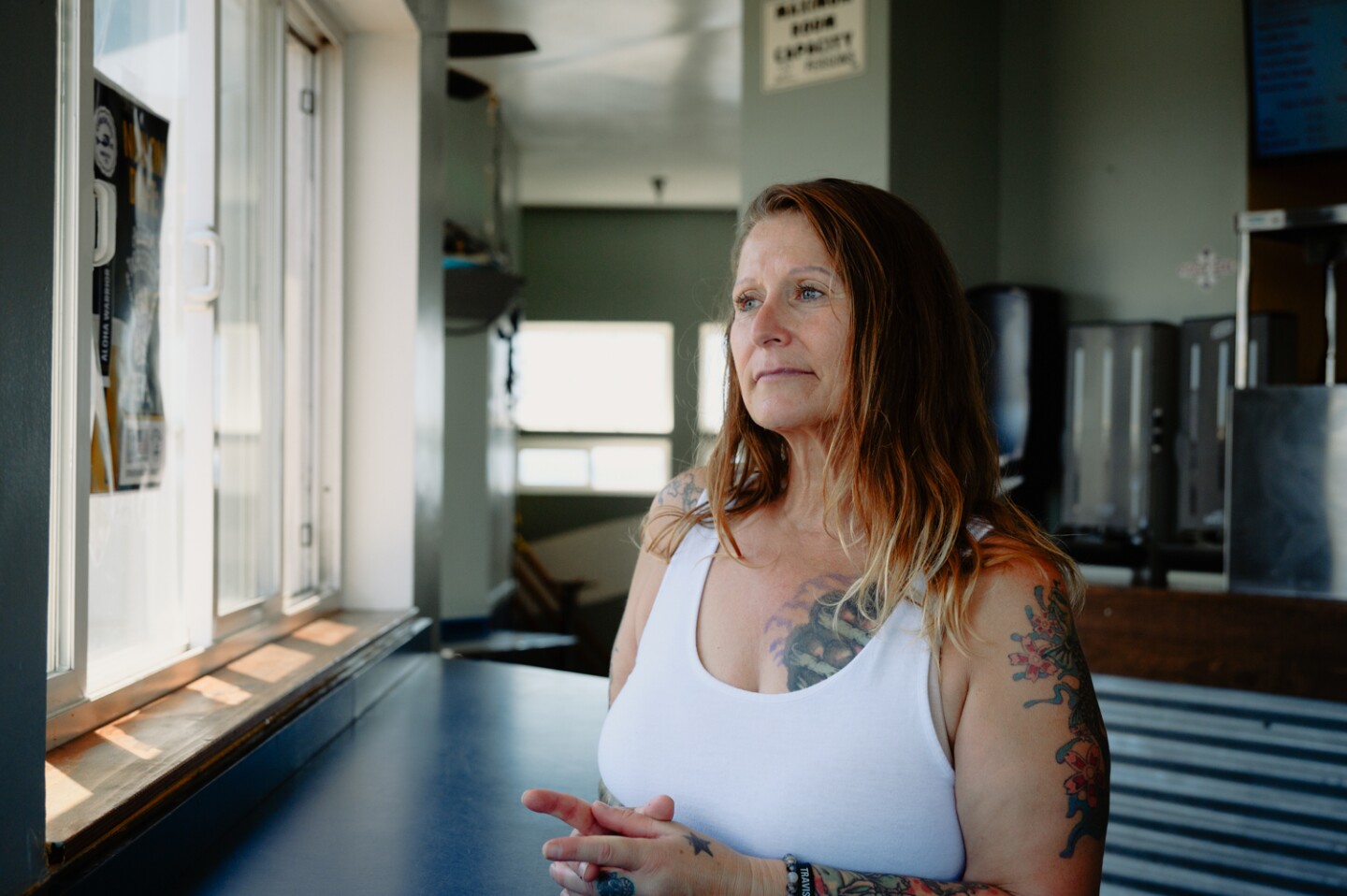 Trisha Baglioni stands for a portrait at the Tin Fish, the restaurant she manages at the end of the Imperial Beach Pier, in Imperial Beach, Calif. on Sept. 3, 2024.