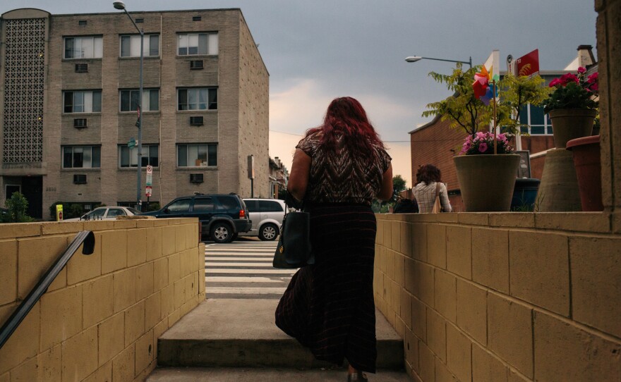 Ruby Corado walks out on to Georgia Avenue from inside Casa Ruby, a drop-in and service center she founded for transgender people in Washington, D.C.