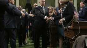 California Gov. Jerry Brown shakes hands with Senate Republican Leader Patricia Bates, of Laguna Nigel, as he walks to the podium to deliver his annual State of the State address before a joint session of the Legislature, Thursday, Jan. 25, 2018. 