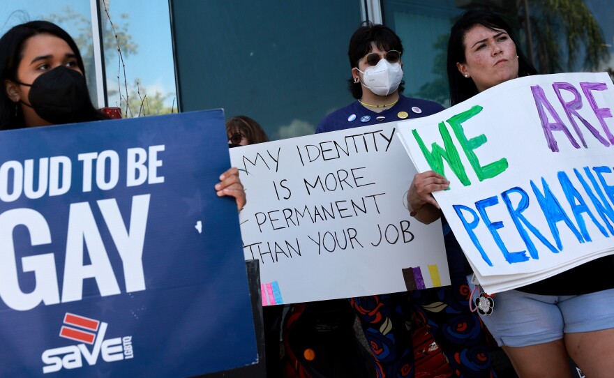 Protestors stand in front of Florida State Senator Ileana Garcia's office after the passage of the Parental Rights in Education bill on March 9.