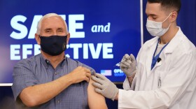 Vice President Mike Pence receives a Pfizer-BioNTech COVID-19 vaccine shot at the Eisenhower Executive Office Building on the White House complex, Friday, Dec. 18, 2020, in Washington. Karen Pence, and U.S. Surgeon General Jerome Adams also participated.