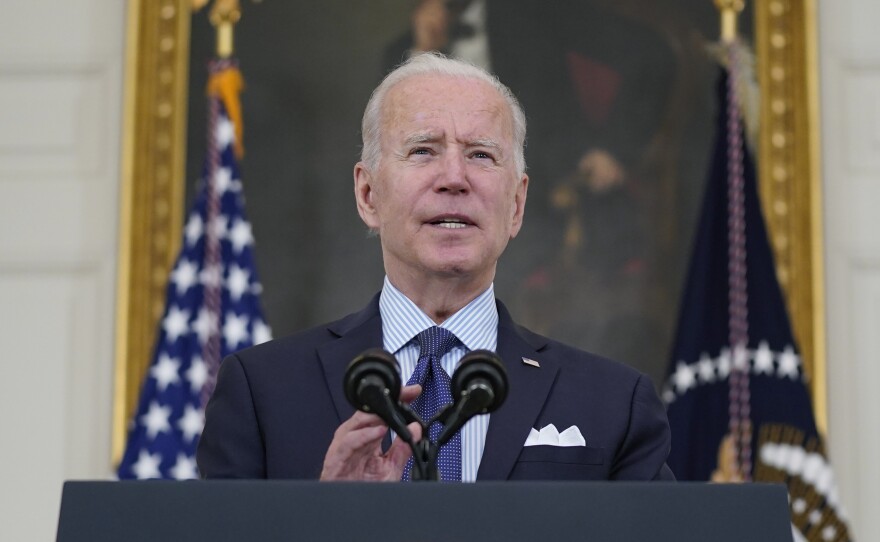 President Biden speaks about the COVID-19 vaccination program Tuesday in the State Dining Room of the White House. Biden has set a goal of seeing 160 million adults fully vaccinated with by the Fourth of July.