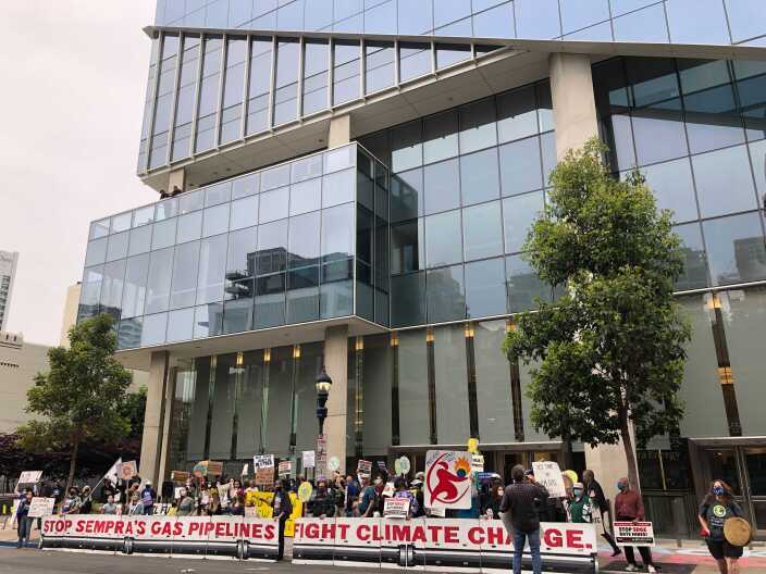 Climate advocates rally outside the downtown San Diego headquarters of Sempra Energy on May 14, 2021.