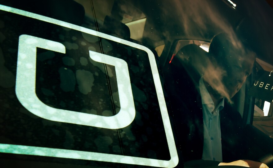 An Uber logo is seen on a vehicle in 2016. MIT researchers say they underestimated the median hourly profit that Uber and Lyft drivers are making.