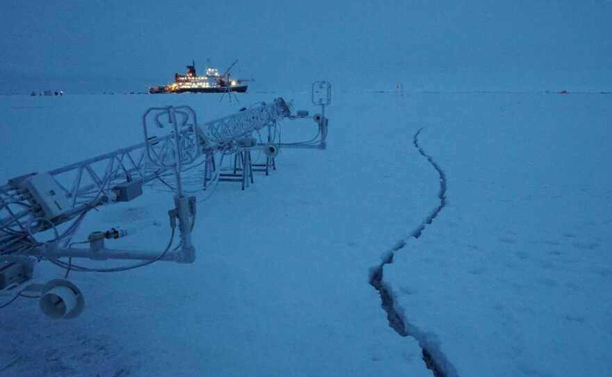 Placement of a tower of instruments used to measure different properties of the atmosphere was delayed a bit by a crack that formed in the ice next to it.