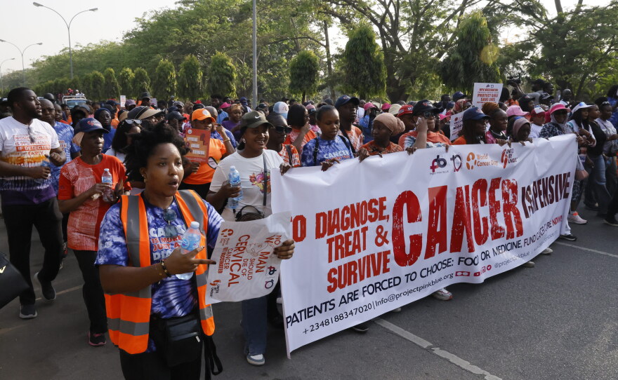 Hundreds of people gather in Abuja, the capital of Nigeria, to mark World Cancer Day on February 7, marching to raise awareness about cancer and the importance of early diagnosis. The World Health Organization cites Nigeria as a country with a rapidly rising number of cancer cases.