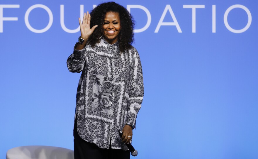 Former U.S. first lady Michelle Obama waves as she attends an event for Obama Foundation in Kuala Lumpur, Malaysia, in December 2019. Obama and actress Julia Roberts attended the inaugural Gathering of Rising Leaders in the Asia Pacific organized by the Obama Foundation.