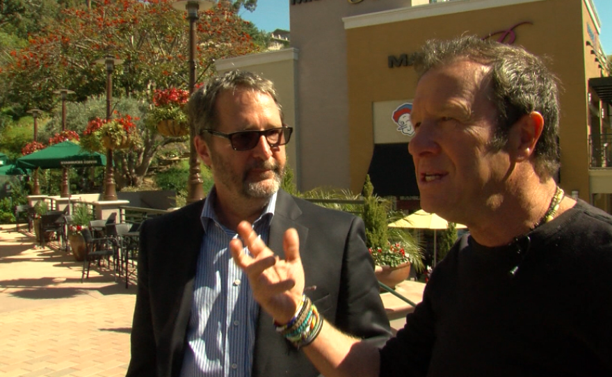 Managing owner of Flower Hill Promenade Jeffrey Essakow (right) speaks to KPBS's Tom Fudge at the mall, March 9, 2017.