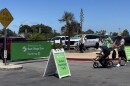 Visitors walk through the parking lot toward the entrance to the San Diego Zoo, July 28, 2025.