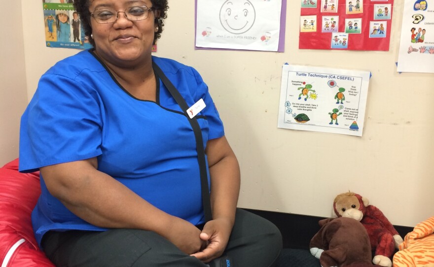 Terrie Walker, known to her preschoolers as Miss Terrie, sits in her Bridgeport classroom's Cozy Corner. The space is meant to help the children manage their own big feelings.