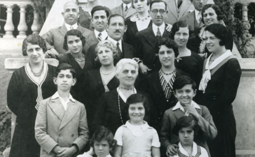 Extended family of Jewish immigrants, originally from Egypt, poses for a portrait at a wedding in 1928, celebrating traditional customs together in their new land. Courtesy of Andre Aciman, author and professor at CUNY Graduate Center, interviewed in "The Jewish Journey: America."