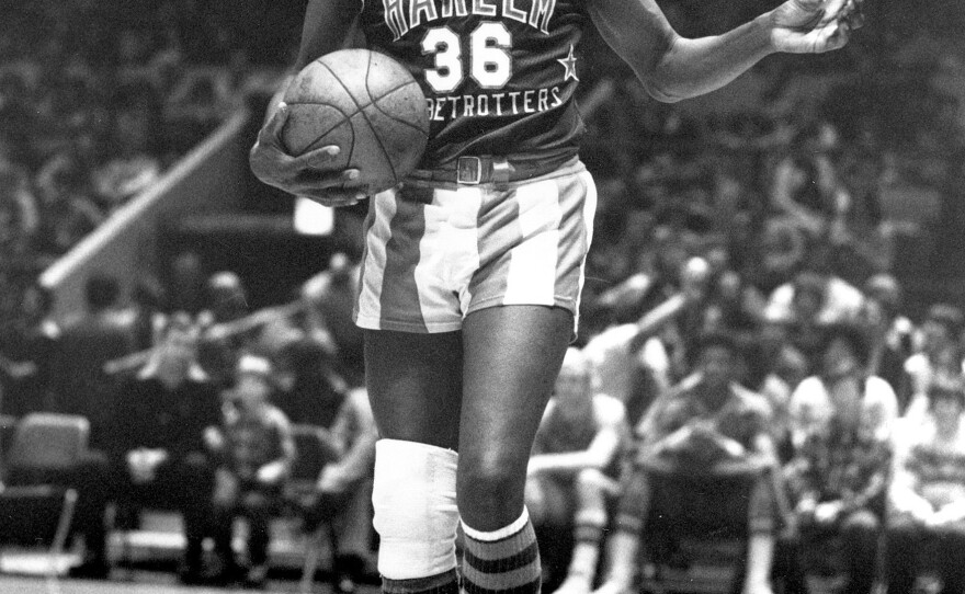 Lemon, who was known as "the clown prince of basketball," offers a pretzel to a referee during a game at New York's Madison Square Garden on Feb. 18, 1978.