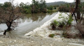 Stormwater runoff cascades over a spillway in the San Gabriel River in El Monte, Calif. on Friday, Dec. 16, 2016.