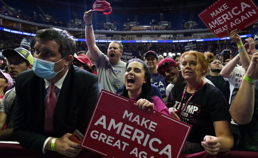 Supporters of President Trump cheer as they attend a campaign rally at the BOK Center on Saturday in Tulsa, Oklahoma.