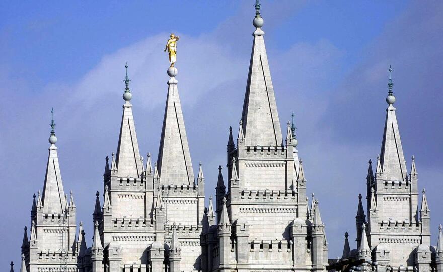 Spires from the Mormon temple in downtown Salt Lake City reach to the sky.
