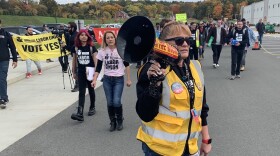 Organizer Heather Goodall, who works at Amazon's warehouse near Albany, N.Y., leads supporters of the Amazon Labor Union in a march on Oct. 10.