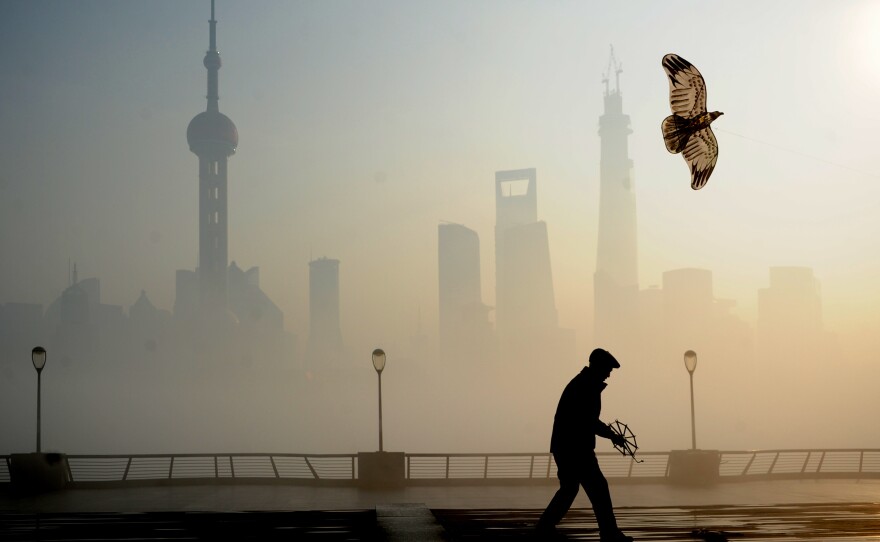 A man flies kite at the Bund on Dec. 5, 2013, in Shanghai.
