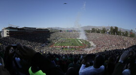 In this photo taken with a fisheye lens, a U.S. Air Force B-2 stealth bomber does a flyover before the Rose Bowl NCAA college football playoff semifinal between Oregon and Florida State in Pasadena, Jan. 1, 2015. 