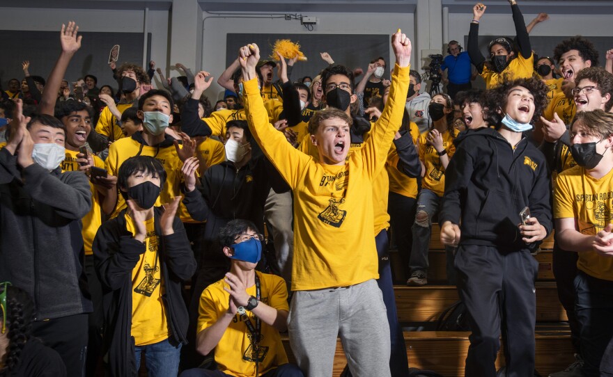 Lara Fernando (upper right corner, black sleeves extended upward) and Spartan Robotics explode the moment they know they have won the 2023 San Francisco Regional and qualified for Houston.