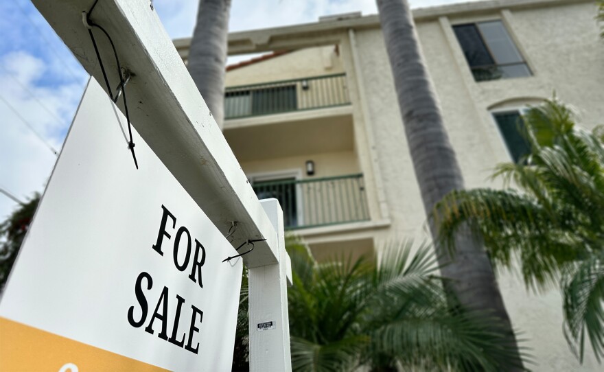 A for sale sign is posted outside a condo in the North Park neighborhood of San Diego on Feb. 27, 2024.