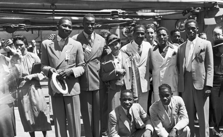 June 15, 1936. Olympic Pride Athletes left to right rear: Dave Albritton and Cornelius Johnson, record high jumpers; Tidye Pickett, woman track star; Ralph Metcalfe, sprinter; Jim Clark boxer and Matthew Robinson, sprinter. In front are John Terry (left) weight lifter and John Brooks, Broadjumper.