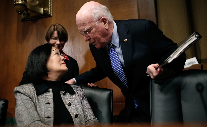 Sen. Patrick Leahy chats with Sen. Mazie Hirono before hearing from retail company executives on Tuesday.