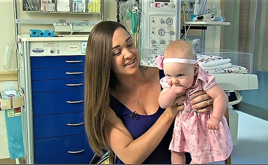 Stephanie Jardin holds her daughter, Avery, on Aug. 9, 2016.